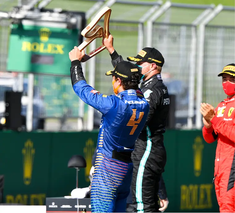Lando lifting trophy